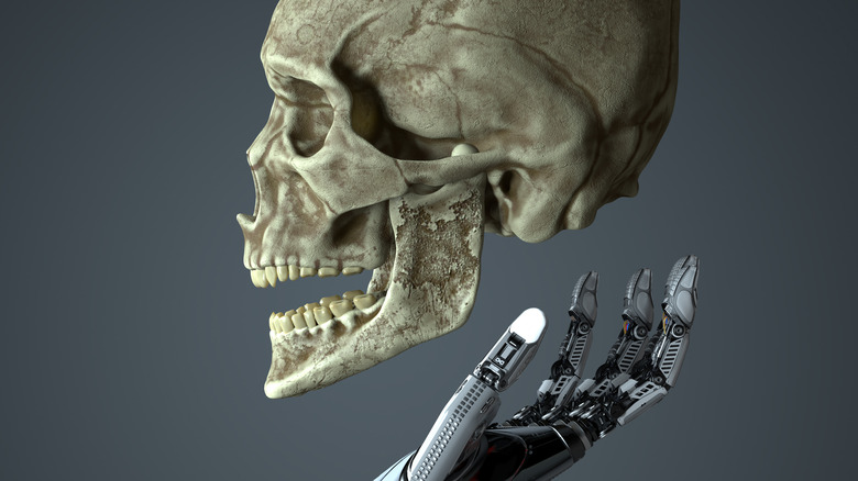 robot holding skull