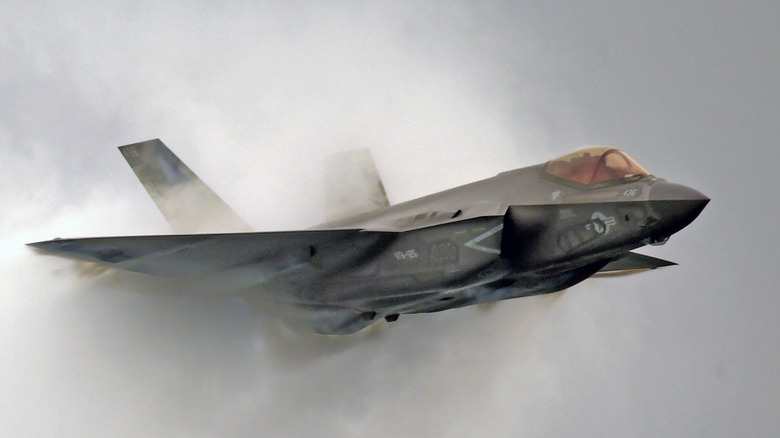 An F-35 surrounded by water vapor.