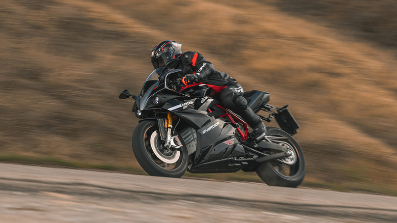 Black Energica EGO + speeding and banking into a turn