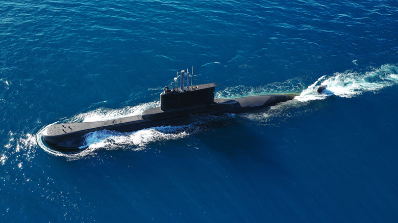 Photo of surfaced naval submarine