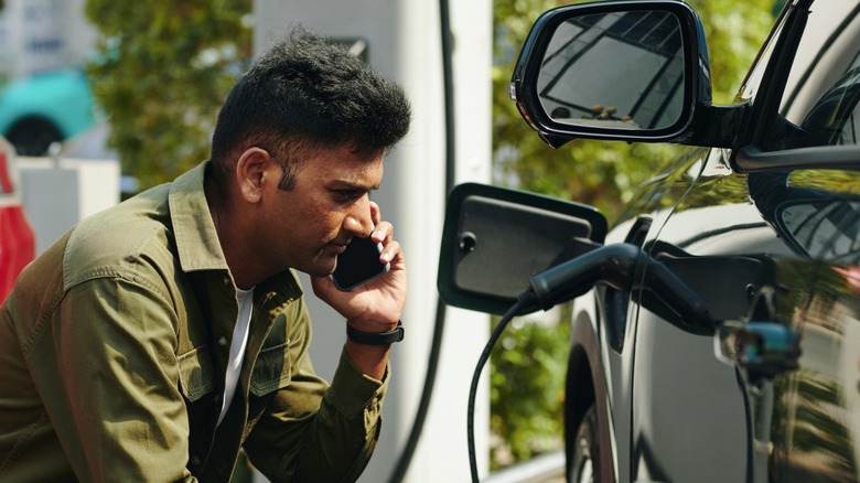 Man reporting a problem at a charging station