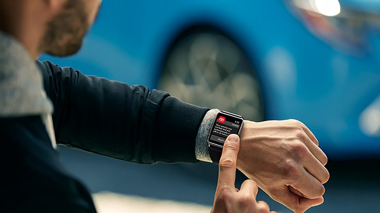 Man connects to his Toyota vehicle with smartwatch Connected Services