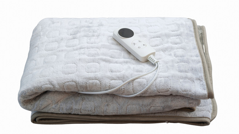 Electric Blanket: A blanket with built-in heating wires used to keep the user warm