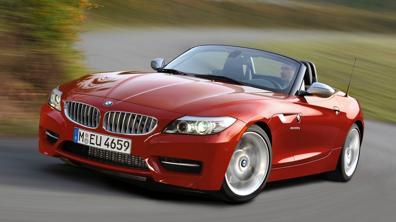 Red 2011 BMW Z4 sDrive35is cornering