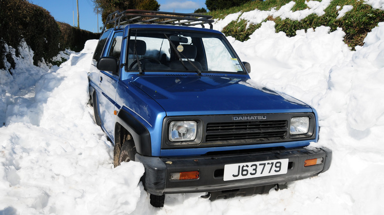 A Daihatsu vehicle in snow