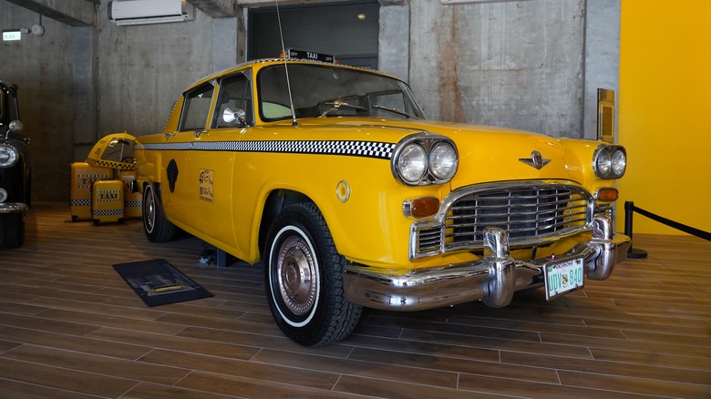 A Checker Marathon taxi cab in a warehouse