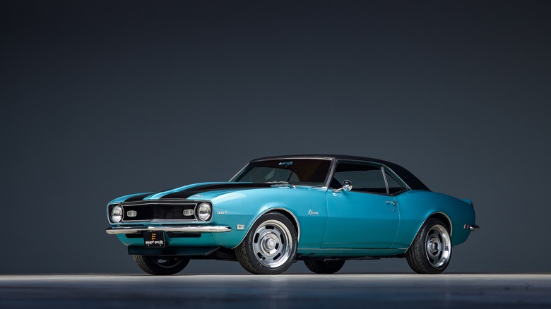 A light blue and black Chevy Camaro on display