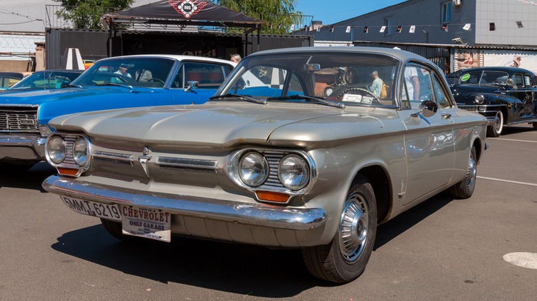 A first-generation Chevy Corvair in a parking lot