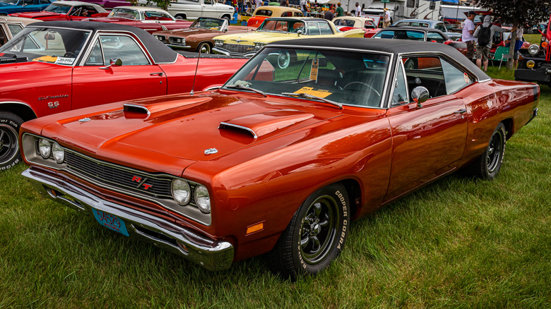 Red 1969 Dodge Coronet R/T parked on grass