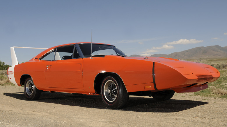 Orange 1969 Dodge Charger Daytona parked on dirt