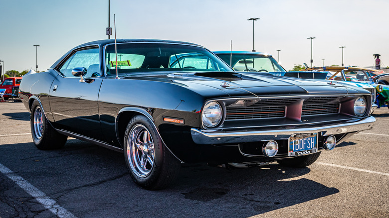 Black 1970 Plymouth Barracuda parked on tarmac