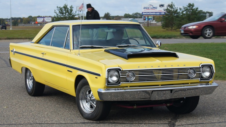 Yellow 1966 Plymouth Belvedere parked on tarmac