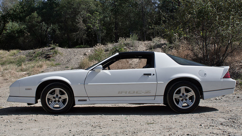 White 1988 IROC-Z Camaro parked on dirt