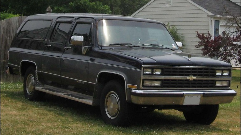 black chevrolet suburban lawn