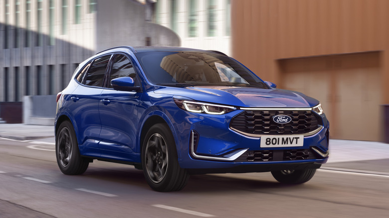 Blue 2024 Ford Kuga on the road