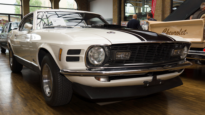 White and blue 1968 - 1970 Ford Mustang on display