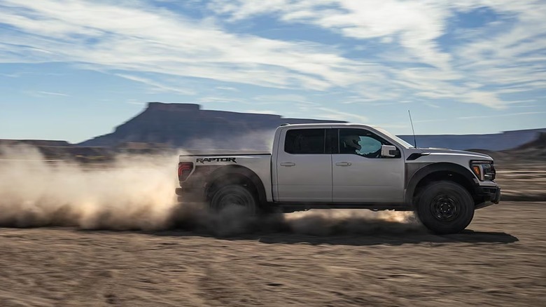 White 2025 Raptor R racing through desert