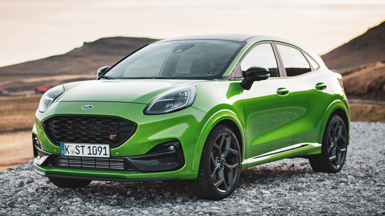 Green Ford Puma ST parked on gravel