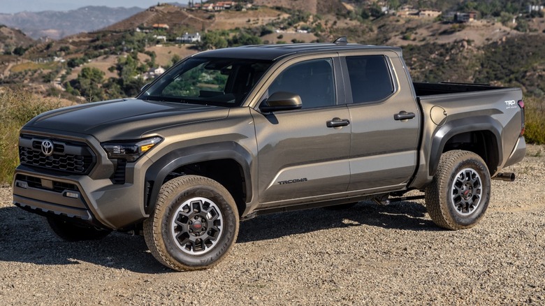 Toyota Tacoma TRD Off-Road parked on dirt with hills in the background