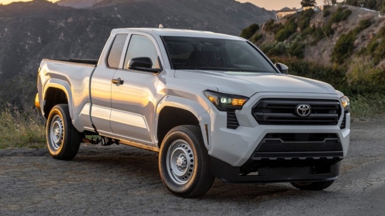 Toyota Tacoma SR parked on the roadside with mountains in the background