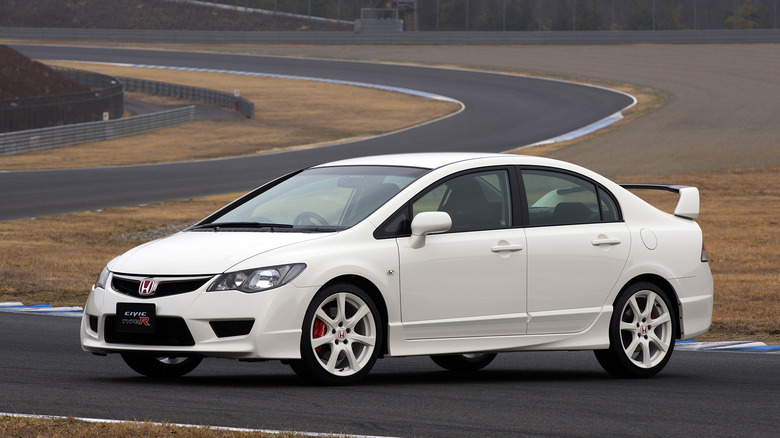 White Honda Civic Type R FD2 front 3/4 on an empty racing track