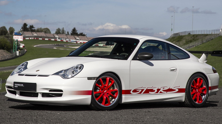 A white Porsche 911 GT3 RS (Type 996) with red details.