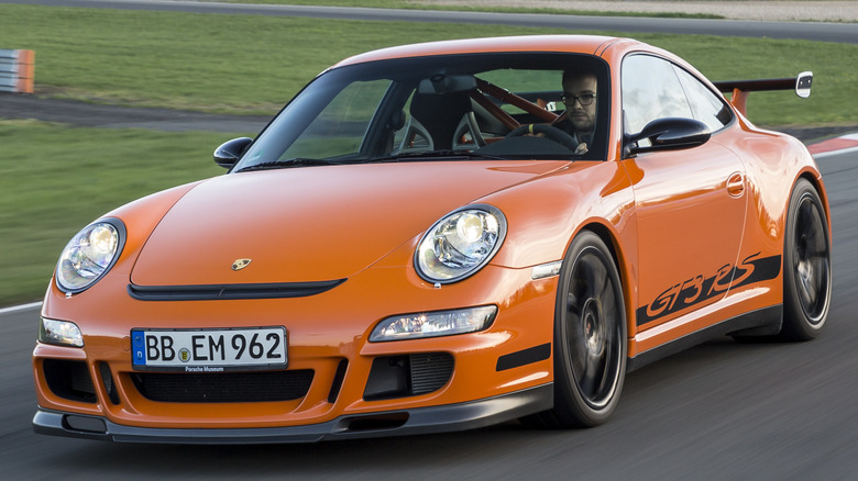 A Porsche 911 GT3 RS (Type 997) on a racetrack.