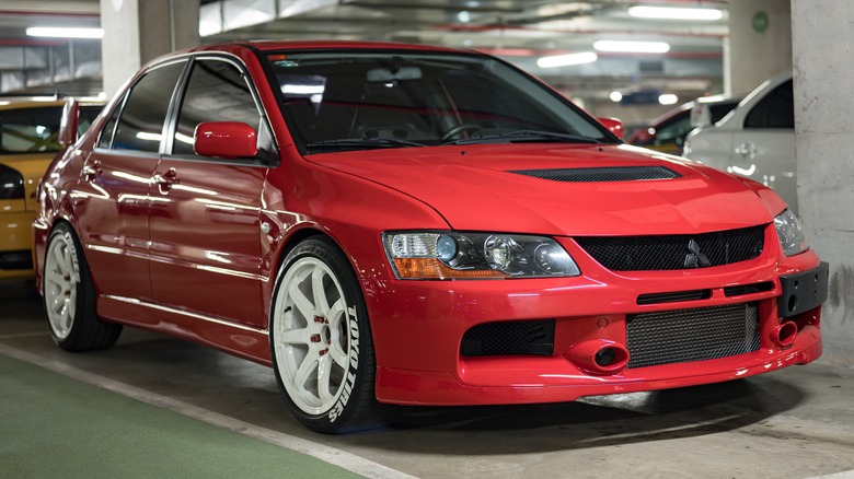 Red Lancer Evo IX Parking lot