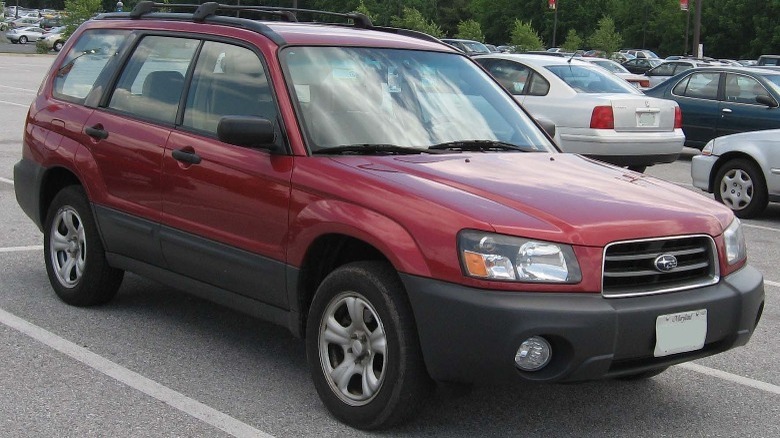 Red 2005 Subaru Forester parked front quarter