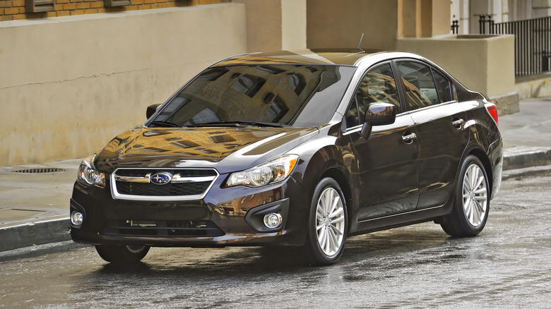 2012 Subaru Impreza on rainy street