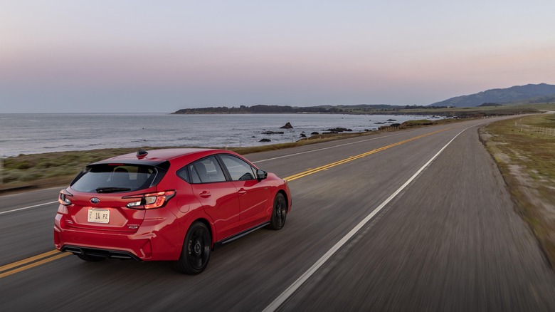 2024 Subaru Impreza driving on coast