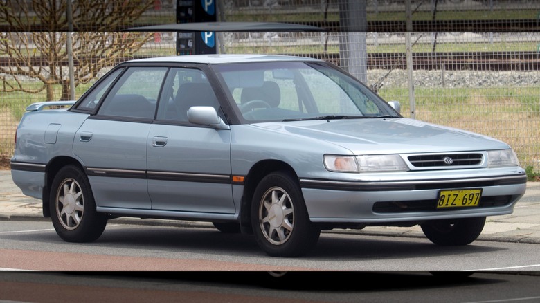 Silver first-generation Subaru Legacy parked