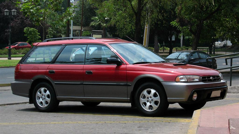 Red 1999 Subaru Legacy Outback parked