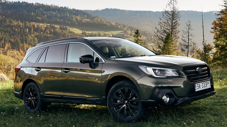 Black 2019 Subaru Outback parked on grass