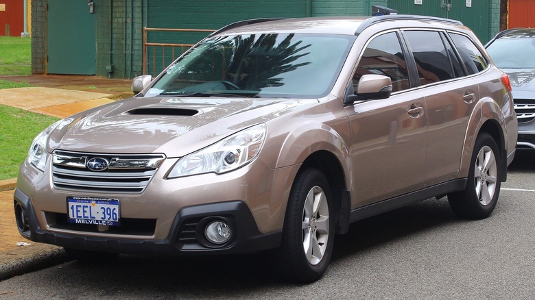 Bronze 2014 Subaru Outback parked on the street