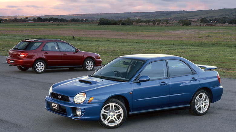 Two second generation Subaru WRXs next to each other