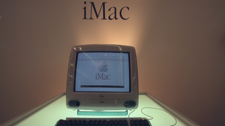 original iMac, which helped popularize USB, at its launch event