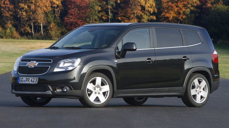 Black 2012 Chevrolet Orlando parked on road