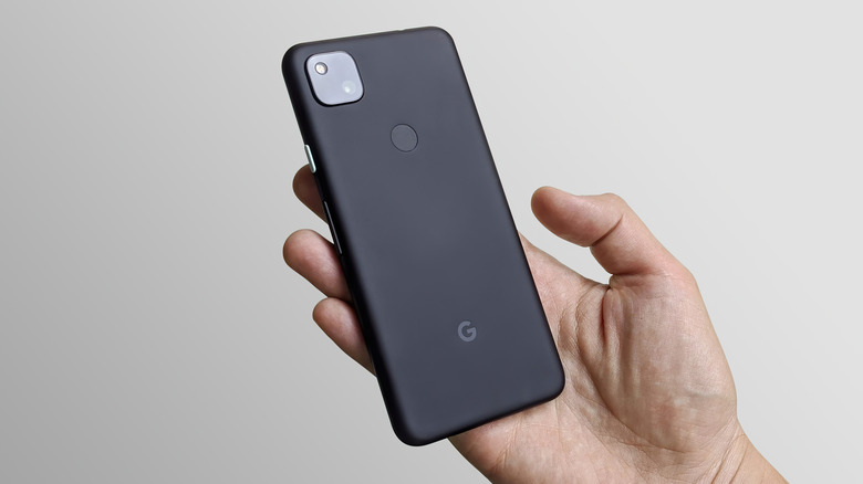 man showing the back of a Google Pixel 4a 5G