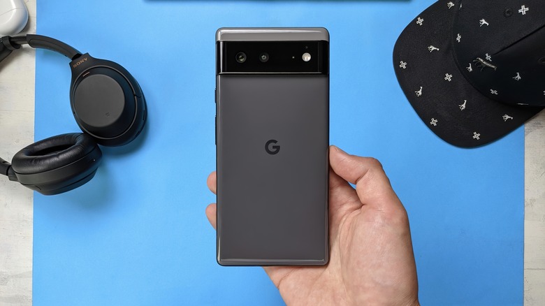 man showing the back of a google pixel 6 smartphone