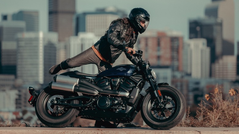 Rider climbing onto 2025 Harley-Davidson Sportster S