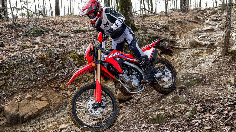 A fully geared up rider on a Honda CRF bike