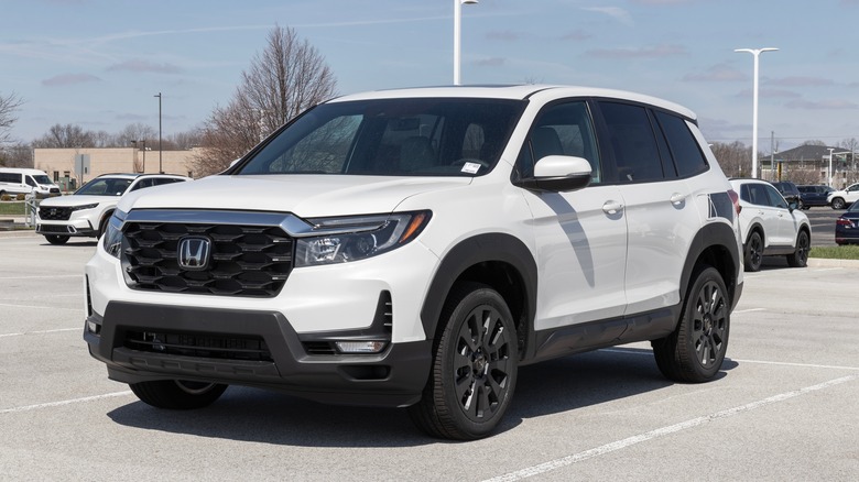 The 2023 Honda Passport in white, front 3/4 view