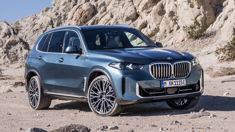 BMW X5 on dirt trail