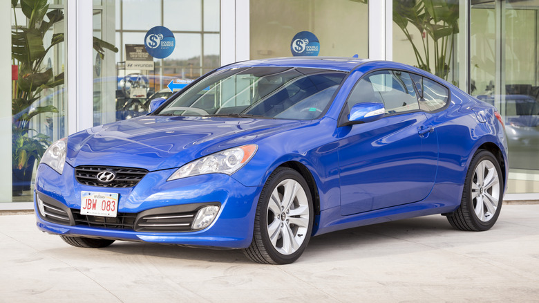 A Hyundai Genesis Coupe in blue, front 3/4 view