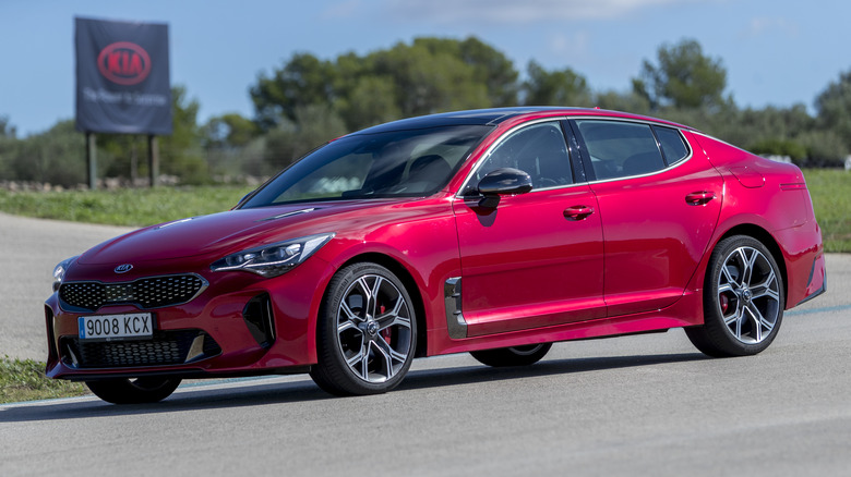 A Kia Stinger GT in red, front 3/4 view