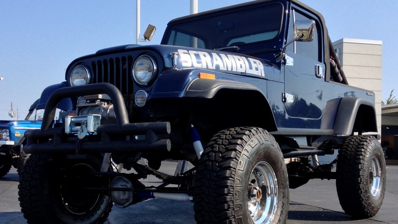 Blue Jeep CJ-8 Scrambler parked