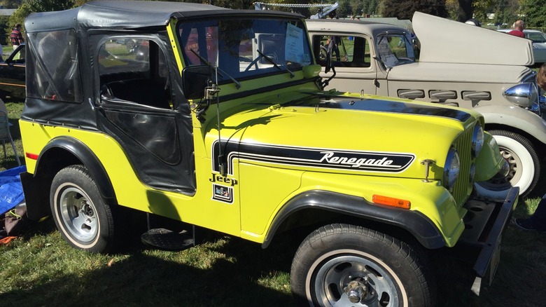 Yellow Jeep CJ-5 Renegade parked at a car show