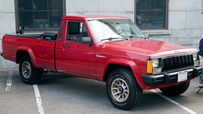 Red Jeep Comanche parked