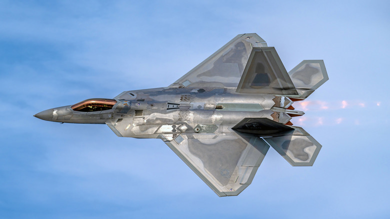 The F-22 flying with afterburner engaged